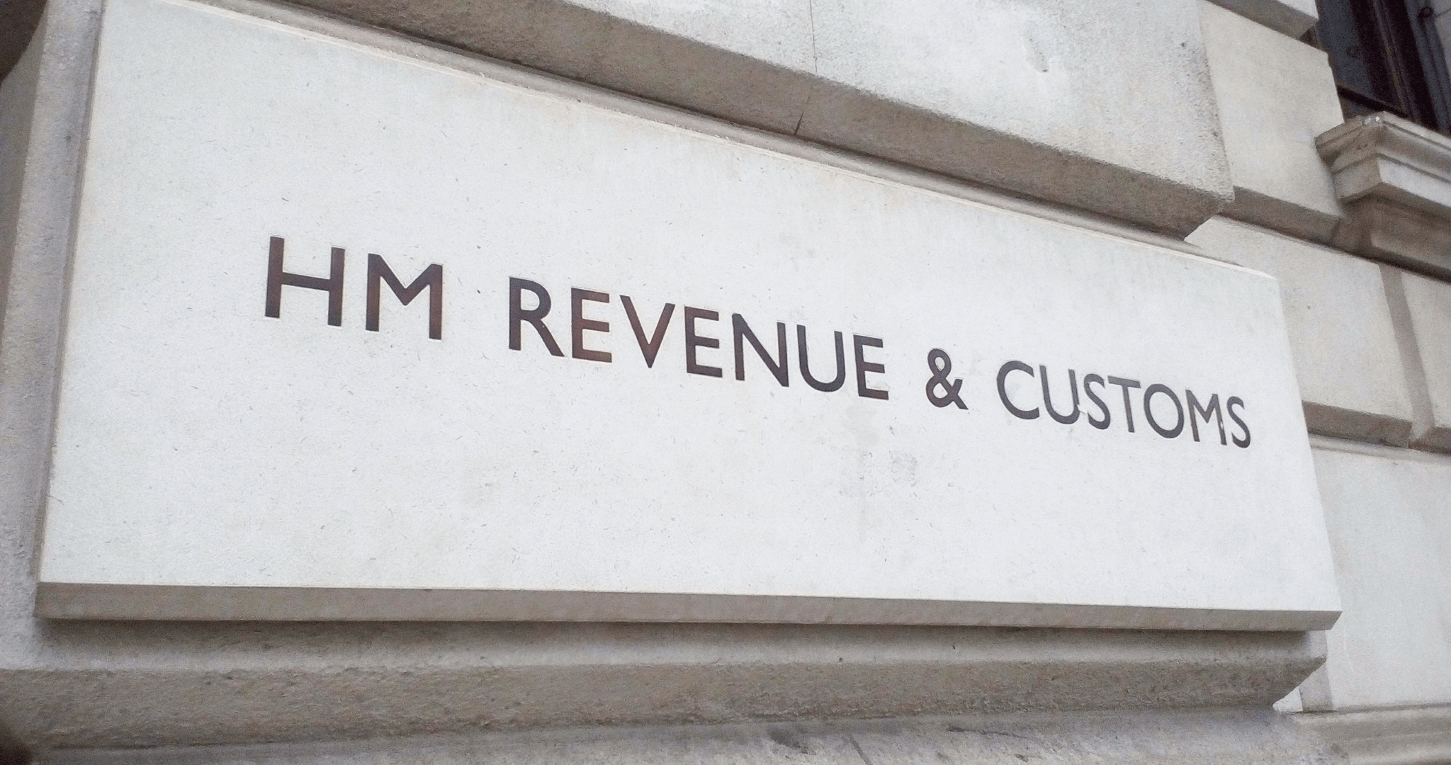 HM Revenue & Customs logo etched into wall