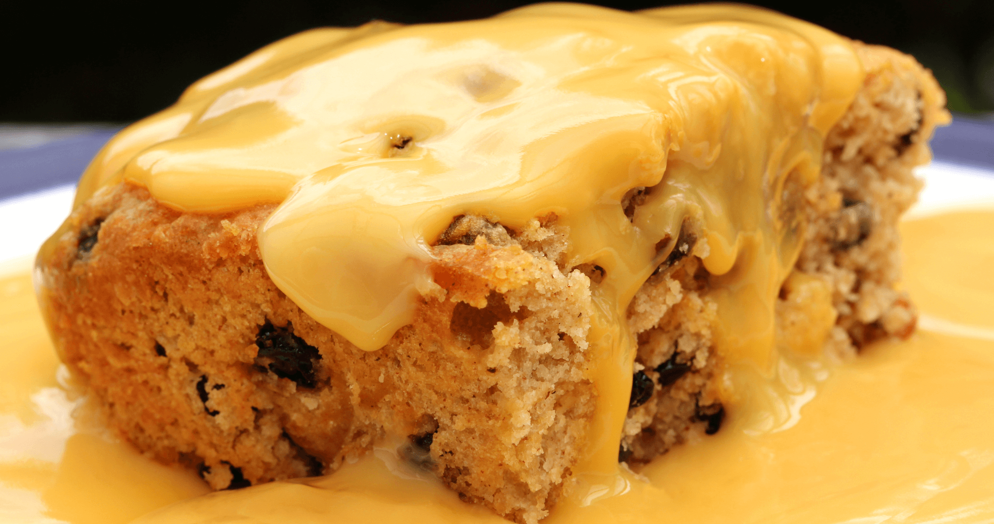 portion of spotted dick with custard