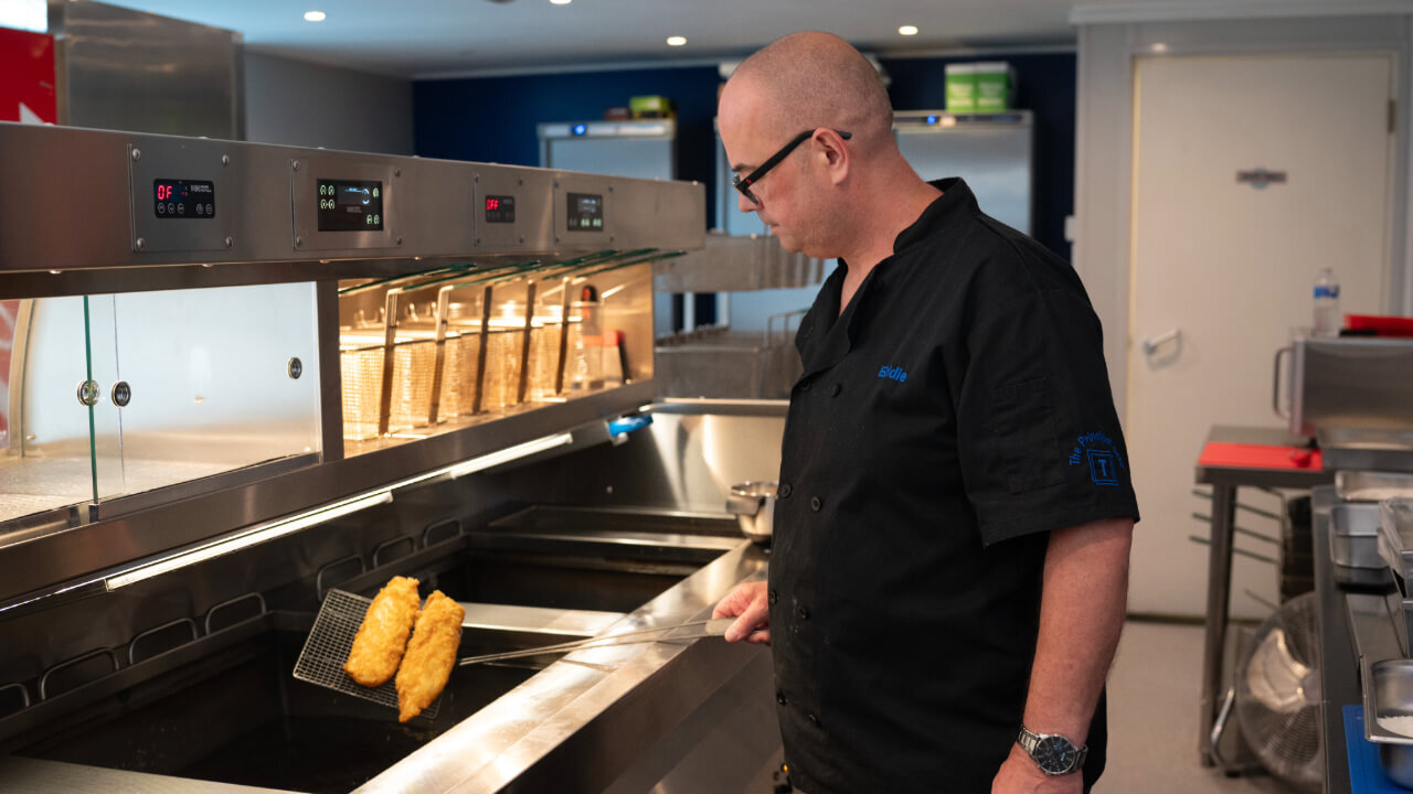 Eddie from the Principal Cafe showing off his golden haddock.